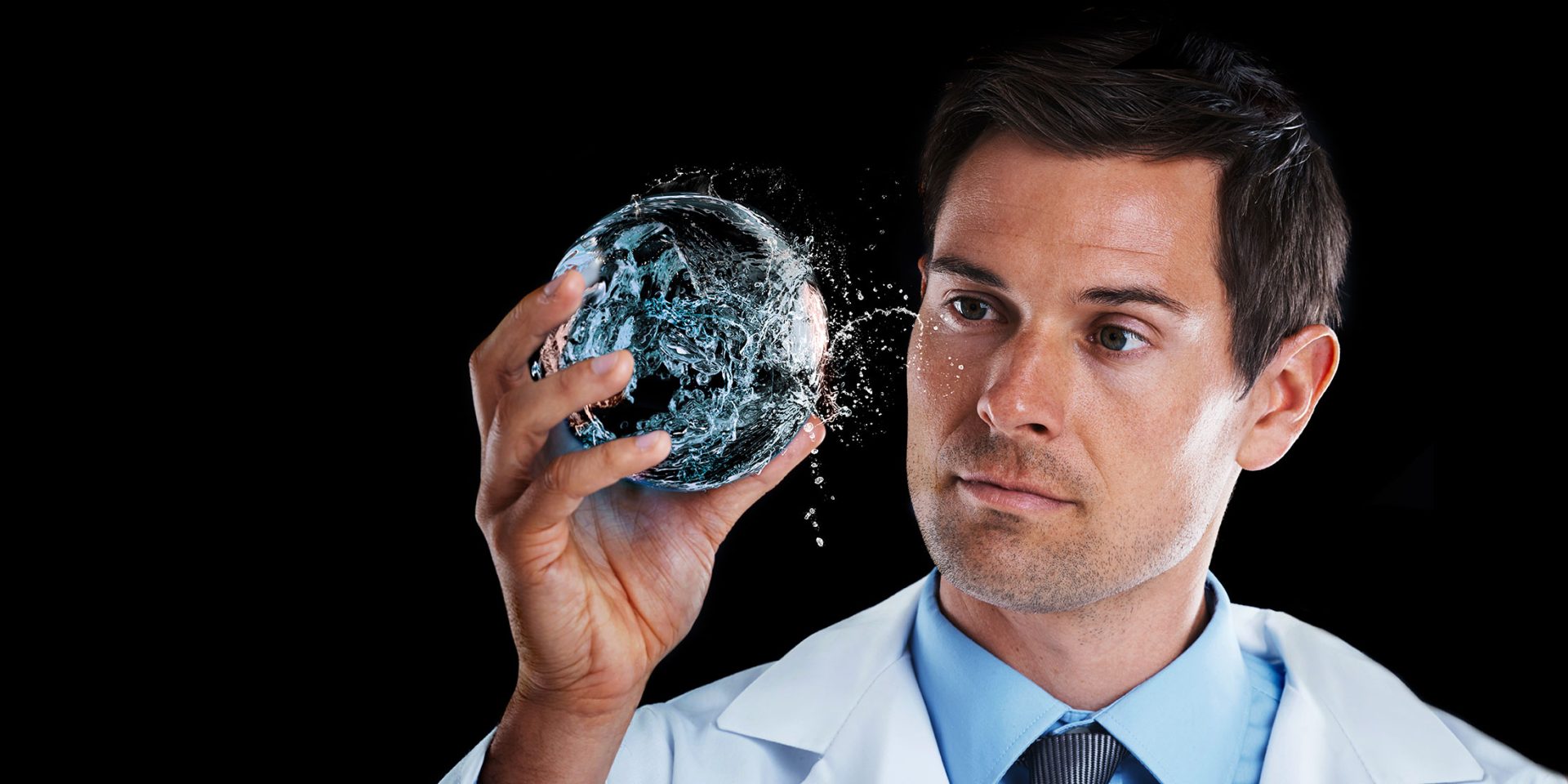 Image Of Employee Holding A Ball Of Water For Our Commercial Water 